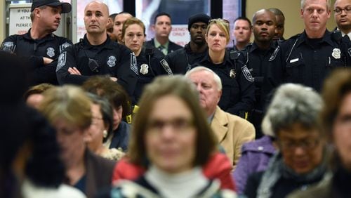 Police officers and other government employees packed the DeKalb County Commission meeting as they urged elected officials to approve pay raises Thursday. HYOSUB SHIN / HSHIN@AJC.COM