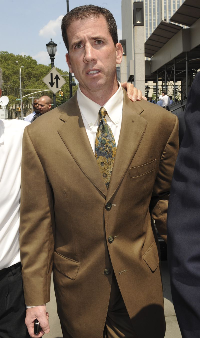 Former NBA referee Tim Donaghy exits Brooklyn federal court following his sentencing July 29, 2008, in New York. Donaghy was sentenced to 15 months in prison for setting off a gambling scandal that tarnished the league's reputation and raised questions about the integrity of its officiating. Louis Lanzano/AP