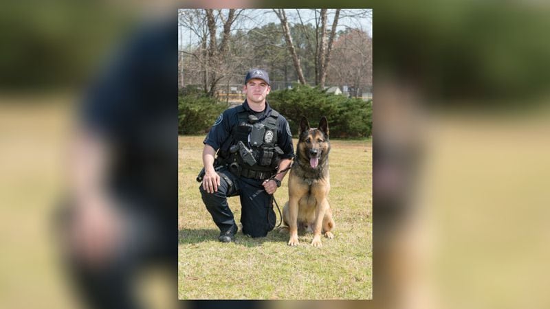 Clayton County police dog Odin is shown with his handler, Officer Baker. (Photo: Clayton County Police Department)