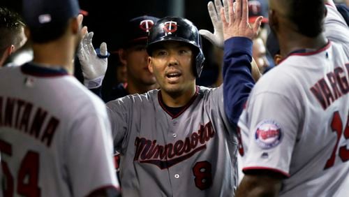 Kurt Suzuki (8) of the Minnesota Twins is congratulated after hitting a home run against the Detroit Tigers late last season. (Photo by Duane Burleson/Getty Images)