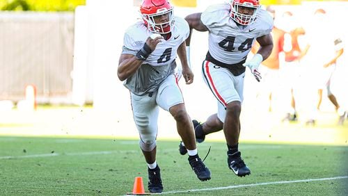 Georgia outside linebacker Nolan Smith (4) and defensive end Travon Walker (44) are two big reasons the Bulldogs believe they can absorb personnel losses on the defensive side of the ball in 2021. (Tony Walsh/UGA Sports)