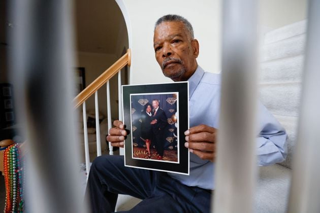 Joseph Larche holds a photograph posing with his late wife Diane Larche on Wednesday, May 15, 2024. Joseph experienced the death of two loved ones recently. His wife Diane Larche passed away on January 12, and two months later his daughter Stephanie died. (Miguel Martinez / AJC)