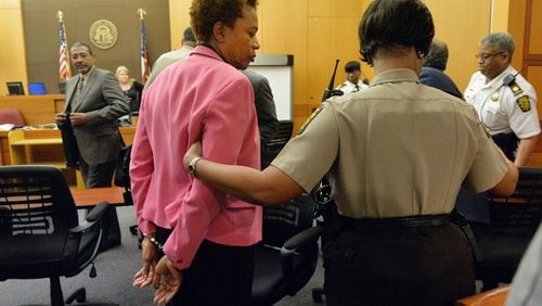 Former APS area superintendent Sharon Davis-Williams is led to a holding cell following her conviction Wednesday on violation of the Racketeer-Influenced and Corrupt Organizations Act. Jurors sorted through roughly five months of testimony against 12 former educators accused of engaging in a racketeering conspiracy to inflate test scores. Eleven of the 12 were convicted. (Atlanta Journal-Constitution, Kent D. Johnson, Pool)