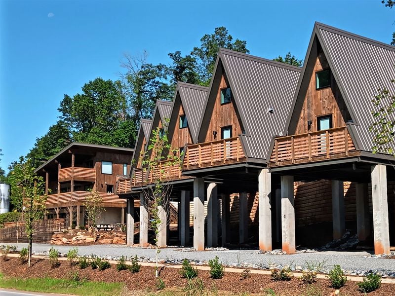 Accommodations at the Wrong Way River Lodge and Cabins are small A-frame units with parking underneath and balconies overlooking Asheville's French Broad River Greenway Park near the River Arts District.
Courtesy of Blake Guthrie