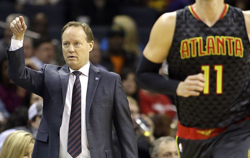 The Atlanta Hawks' head coach Mike Budenholzer points from the sidelines as his team moves the ball up the court against the Charlotte Hornets Wednesday, Jan. 13, 2016. (AP)