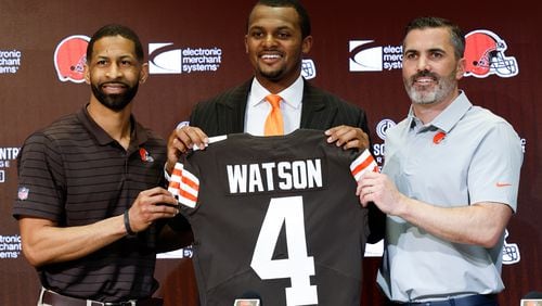 Cleveland Browns general manager Andrew Berry (left), new quarterback Deshaun Watson (center) and coach Kevin Stefanski pose for a photo during a news conference at the NFL team's training facility March 25 in Berea, Ohio. (AP Photo/Ron Schwane)