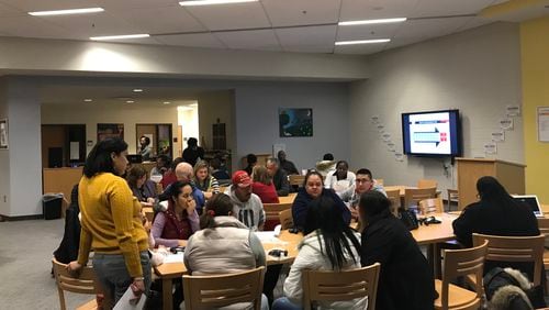 Parents and community members meet at Sutton Middle School on Tuesday, Jan. 22, 2019, to hear about the Atlanta school district's plans to rate all schools.