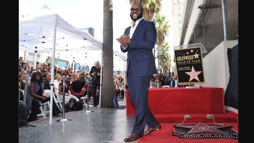 Filmmaker/actor Tyler Perry, known for the "Madea" films, appears during a ceremony honoring him with with a star on the Hollywood Walk of Fame on Oct. 1, 2019, in Los Angeles. (Photo by Richard Shotwell/Invision/AP, File)