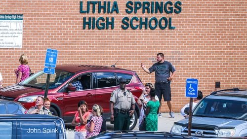 Lithia Springs High School students were sent to the gym Thursday morning to wait for parents to arrive or their bus. (Photo: John Spink/jspink@ajc.com)
