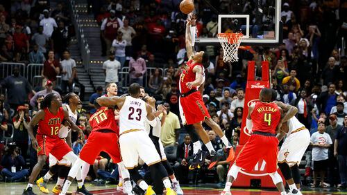 Atlanta Hawks forward Kent Bazemore (24) goes up for the jump ball in the final seconds of the second half of an NBA basketball game against the Cleveland Cavaliers on Sunday, April 9, 2017, in Atlanta. The Hawks won in overtime 126-125. (AP Photo/Todd Kirkland)