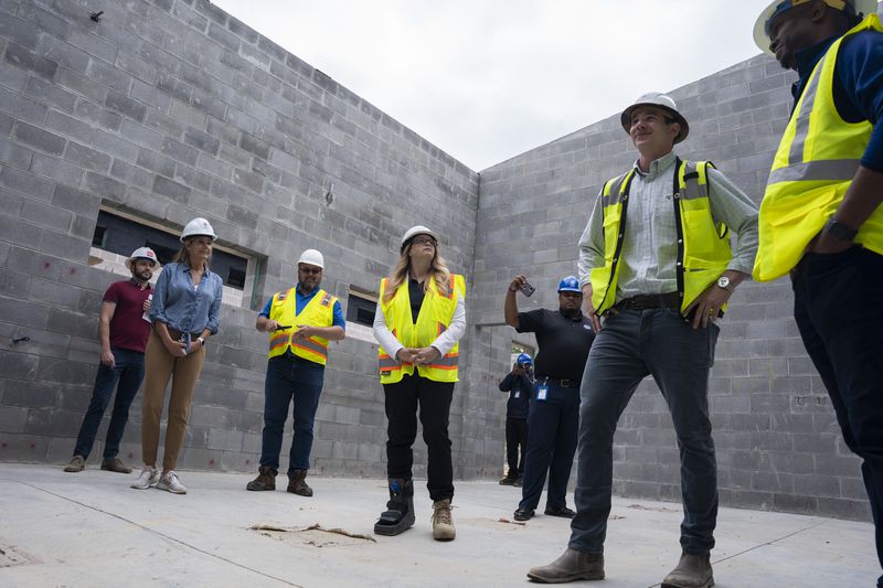 Construction workers give Fulton County Commissioners a tour of the new animal shelter which is set to open this fall in Fulton County, on Friday, May 19, 2023.  (Olivia Bowdoin for the Atlanta Journal Constitution).