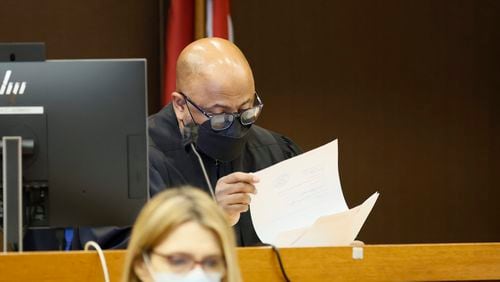 Fulton County Superior Court Chief Judge Ural Glanville looks at documents during the Jury selection portion of the trial that continues on Monday, Feb. 13, 2023.  Miguel Martinez / miguel.martinezjimenez@ajc.com 