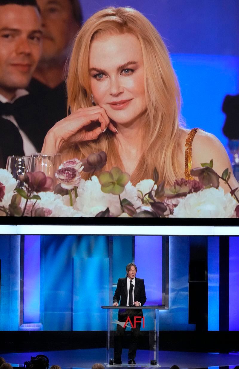 Honoree Nicole Kidman, top, is seen on a video monitor as her husband Keith Urban speaks about her during the 49th AFI Life Achievement Award tribute to Kidman, Saturday, April 27, 2024, at the Dolby Theatre in Los Angeles. (AP Photo/Chris Pizzello)