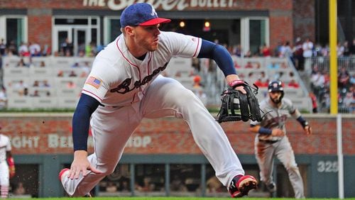 Braves star Freddie Freeman made his first big-league start at third base on Tuesday. (Scott Cunningham/Getty Images)