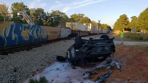 A collision between a train and a car in Coweta County left a man in critical condition.