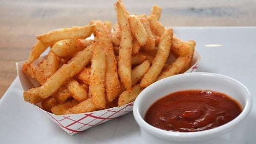 Yumbii’s sesame fries are tossed with sesame oil and a sweet-salty seasoning that includes the heat of Korean chili flakes. Photo: courtesy of Yumbii