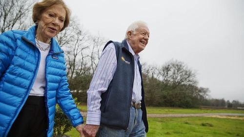 Former President Jimmy Carter, right, and his wife Rosalynn arrive for a ribbon cutting ceremony for a solar panel project on farmland he owns in their hometown of Plains, Ga., Wednesday, Feb. 8, 2017.  (AP Photo/David Goldman)