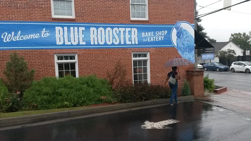 Several restaurants, including the Blue Rooster Bake Shop and Eatery, already exist around Lawrenceville’s town square, site of the old Gwinnett County courthouse. City officials are encouraging development of homes nearby to boost the city center. MATT KEMPNER / AJC