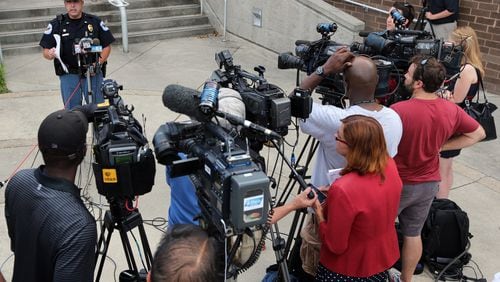 Cobb Police Public Information Officer Michael Bowman talks to members of the media Wednesday evening, June 25, 2014, about the investigation into the death of a 22-month-old left in an SUV last week.
