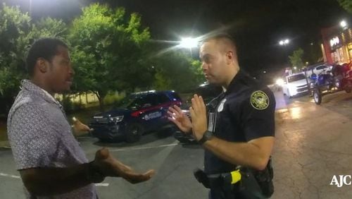 Rayshard Brooks talks with Atlanta Police Officer Garrett Rolfe in Wendy's parking lot before Rolfe shoots him in the back, killing him. Contributed