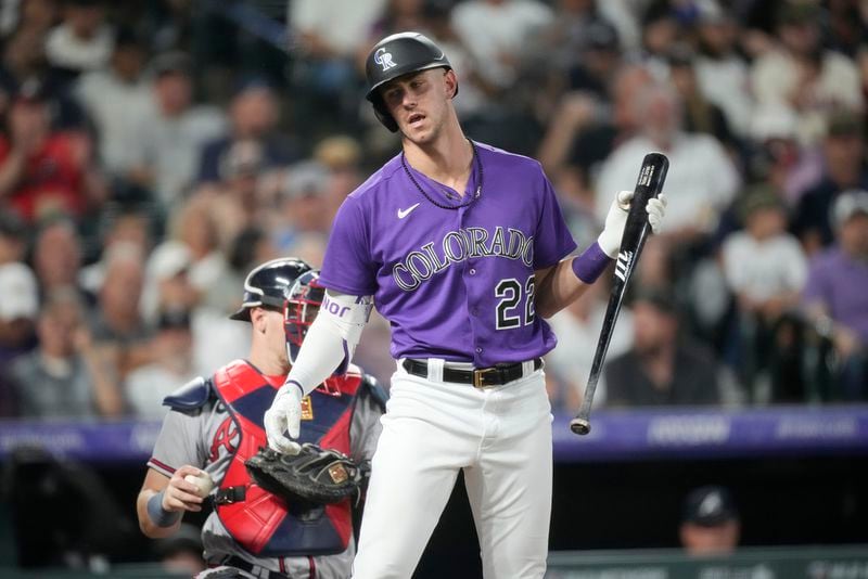 Colorado Rockies' Nolan Jones reacts after striking out against Atlanta Braves starting pitcher Charlie Morton in the fourth inning of a baseball game Tuesday, Aug. 29, 2023, in Denver. (AP Photo/David Zalubowski)