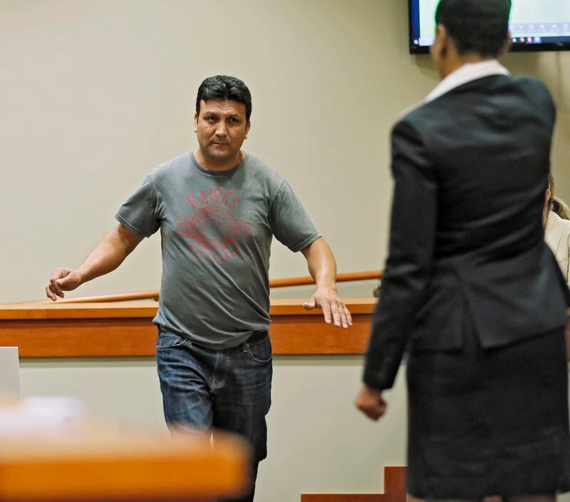 September 27, 2019 - Decatur -  Miguel Medina, who witnessed the shooting, demonstrates to prosecutor Buffy Thomas, how Anthony Hill was running toward Officer Robert Olsen before he was shot.  The murder trial of former DeKalb County Police Officer Robert "Chip" Olsen continued with testimony from prosecution witnesses this morning.  Olsen is charged with murdering war veteran Anthony Hill.  Bob Andres / robert.andres@ajc.com