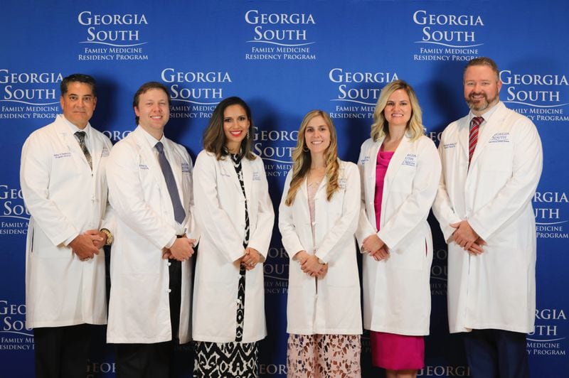 Georgia South Family Medicine Residency Program graduated its third class of residents on June 26 at Colquitt County Arts Center. Pictured, from left, is Georgia South Program Director Kirby Smith, DO, class of 2021 graduates Robert Jeter, MD, Giselle Piñeiro, DO, Kayla Batchelor, DO, Madison Lamar Hill, DO, and Associate Program Director Woodwin Weeks, DO.