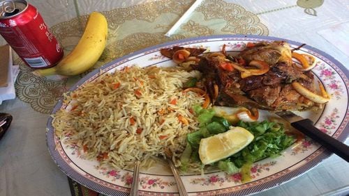 A Somali plate of lamb and basmati rice, with a banana. (Matt Pearce/Los Angeles Times/TNS)