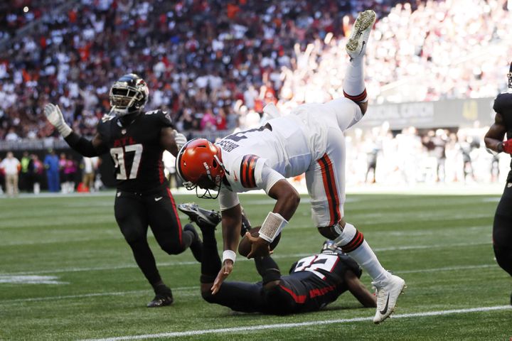 Browns quarterback Jacoby Brissett goes airborne as he crosses the goal line for his team's first touchdown on Sunday against the Falcons in Atlanta. (Miguel Martinez / miguel.martinezjimenez@ajc.com)