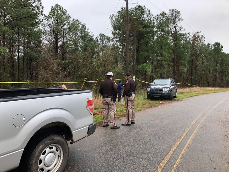Investigators  are on the scene Wednesday in the wooded area on Greer Road where Anitra Gunn’s body was found. 