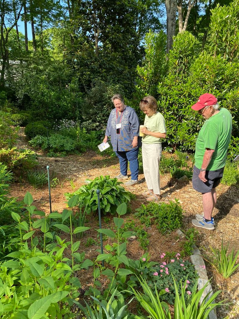 Amateur gardeners take notes at the Smyrna Garden Tour presented by Keep Smyrna Beautiful. 
(Courtesy of Keep Smyrna Beautiful / Eloise Holland)