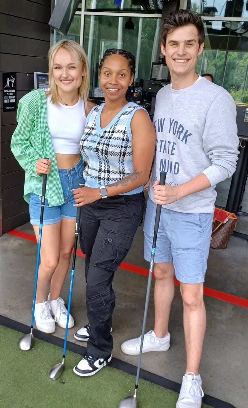2023 Shuler Award winners Emily Marx (left) and Trever Arnold (right) pose with 2010 Jimmy Award winner Alexandria Payne (middle) during a day of Topgolf. Payne offered advice about the upcoming Broadway competition./ Courtesy of Nicholas Wolaver