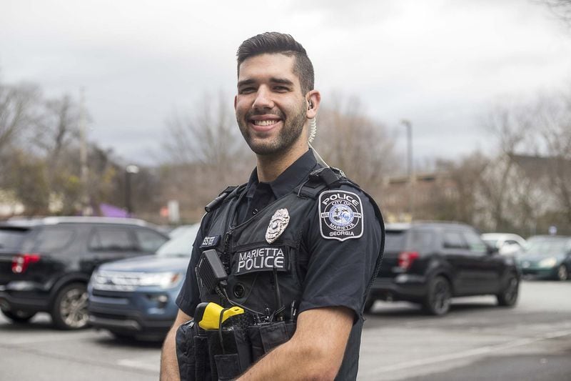 01/15/2019 — Marietta, Georgia — Marietta Police Officer Mark Eister, 20, poses for a photo before going home from his shift at the Marietta Police Department in Marietta, Wednesday, January 15, 2020. Officer Eister started as a Marietta public safety ambassador. (ALYSSA POINTER/ALYSSA.POINTER@AJC.COM)