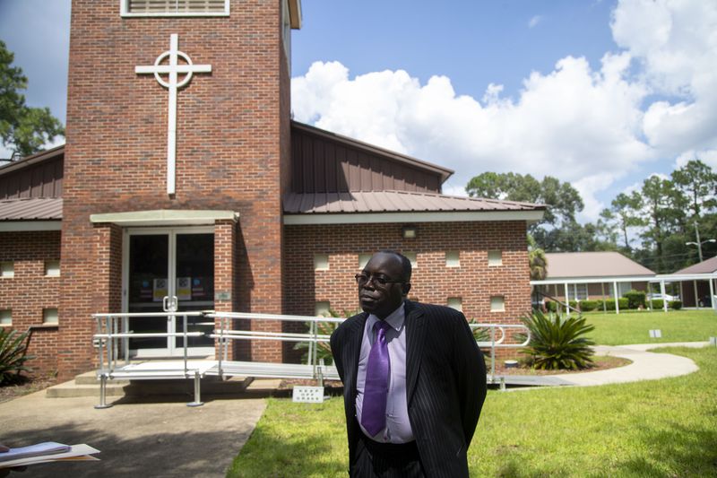 In the Avalon neighborhood in west Albany, Pastor Michael White of Litman Cathedral House of God Saints In Christ, says he recently applied for a gun carry permit. “Crime used to take place at night, now it’s in broad daylight,” White said. (Alyssa Pointer/Atlanta Journal Constitution)