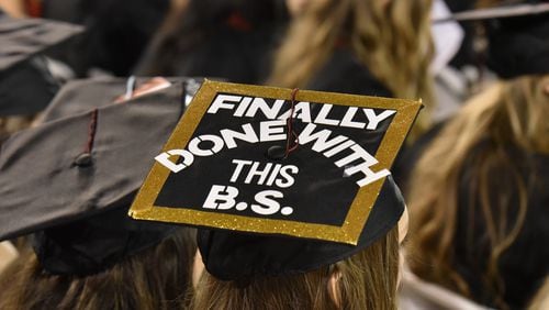 May 4, 2018 Athens - University of Georgia students wear decorated caps during the 2018 spring undergraduate commencement ceremony at Sanford Stadium in Athens. The B.S. on this student’s cap probably means bachelor’s of science. Probably.