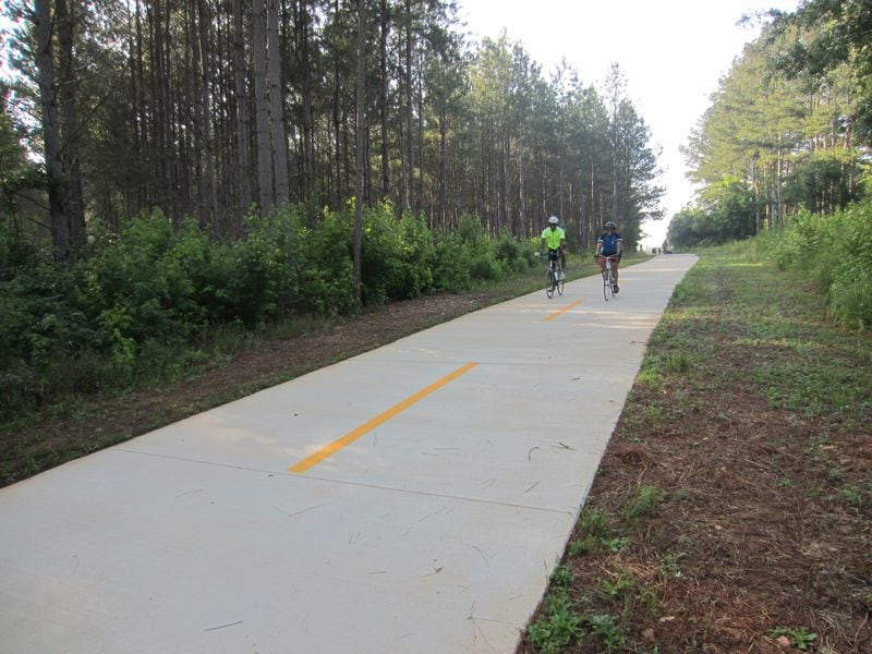 Bicyclists enjoy the Arabia Mountain PATH’s southern stretch, located on the grounds of the Monastery of the Holy Spirit in Rockdale County. Contributed by Arabia Mountain Heritage Area Alliance