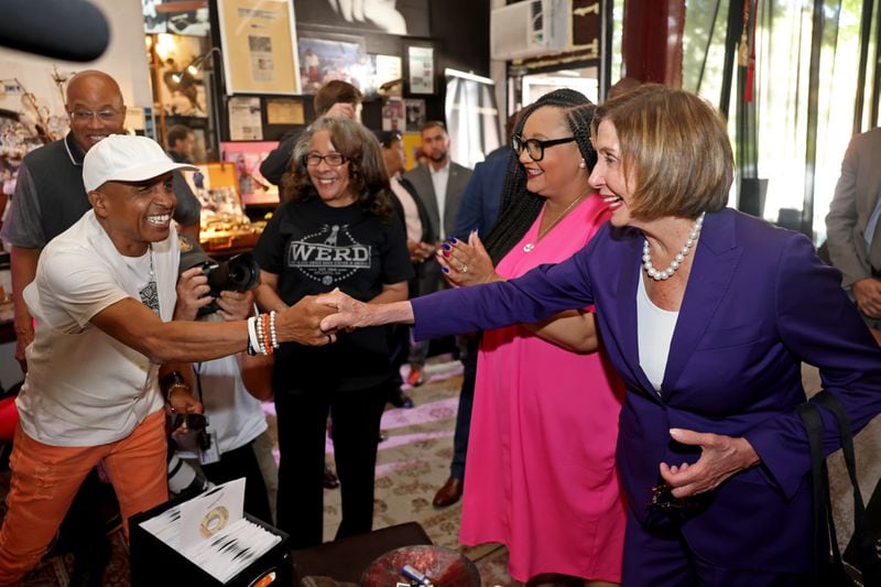 Musician Chicago Mike of Kool and the Gang greets U.S. House Speaker Nancy Pelosi during a visit Thursday to the Madame C.J. Walker Museum in Sweet Auburn. (Jason Getz / Jason.Getz@ajc.com)