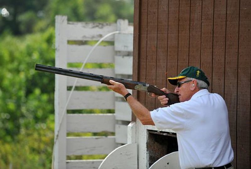 Georgia coaching legend Vince Dooley shoots Skeet at the Tom Lowe Trap and Skeet Range Saturday in Atlanta. Dooley was one of several sports stars and celebrities paired with war veterans for the event, presented by the North Metro Miracle League and the Faces of Freedom.
