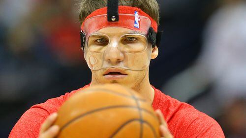 032215 ATLANTA: Hawks guard Kyle Korver wears a protective mask as he prepares to play against the Spurs returning to action for the first time since breaking his nose against Los Angeles during a basketball game on Sunday, March 22, 2015, in Buford. Curtis Compton / ccompton@ajc.com