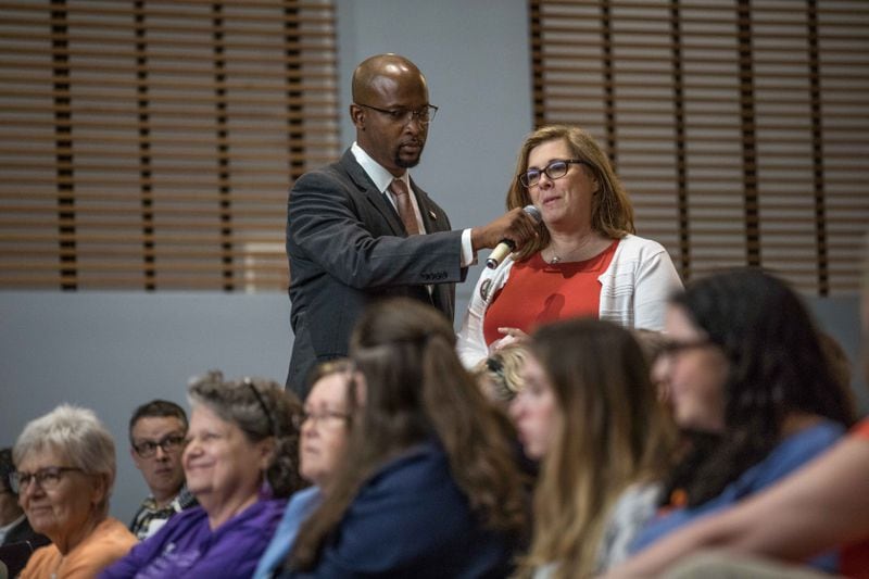 Lori Goldstrom asks U.S. Rep. Lucy McBath, D-Marietta., a question during a town hall at Dunwoody High School on Saturday, June 8, 2019.  (Photo: Branden Camp/Special to the AJC)