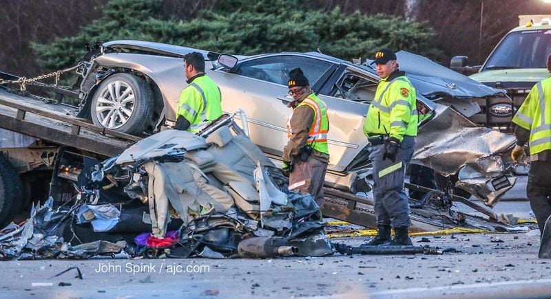 Authorities investigated a deadly multi-vehicle crash on I-20 East just before the Downtown Connector. JOHN SPINK / JSPINK@AJC.COM