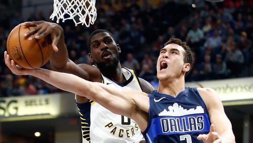Alex Poythress of the Indiana Pacers blocks the shot of Dwight Powell of the Dallas Mavericks during the game at Bankers Life Fieldhouse on December 27, 2017 in Indianapolis, Indiana.  (Photo by Andy Lyons/Getty Images)