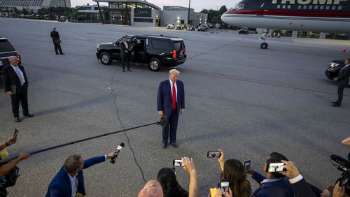 Former President Donald Trump spoke to reporters at Hartsfield-Jackson Atlanta International Airport after surrendering at the Fulton County jail in Atlanta on Thursday, Aug. 24, 2023. (Doug Mills/The New York Times)