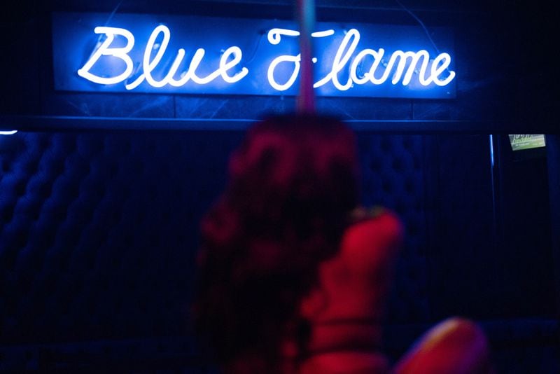Kiyana Neal, stage name Cookie, performs at Blue Flame Lounge, Wednesday, October 18, 2023, in Atlanta. (Hyosub Shin / Hyosub.Shin@ajc.com)