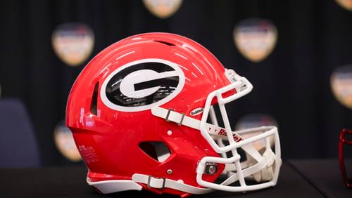 The football helmet of Georgia is shown before the head coaches joint press conference at the Le Meridien Dania Beach Hotel, Friday, Dec., 29, 2023, in Fort Lauderdale, Florida. (Jason Getz / Jason.Getz@ajc.com)