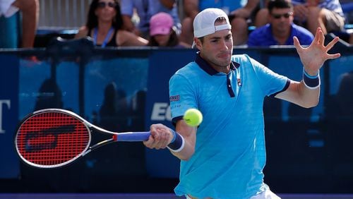 Former UGA player John Isner returns a shot from Ryan Harrison during the BB&T Atlanta Open finals Sunday at Atlantic Station. Isner captured the title by defeating Harrison 7-6 (6), 7-6 (7).