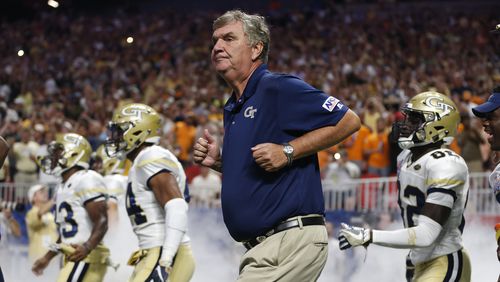 Georgia Tech head coach Paul Johnson runs onto the field with his players before in the first half of an NCAA college football game against the Tennessee Monday, Sept. 4, 2017, in Atlanta. (AP Photo/John Bazemore)