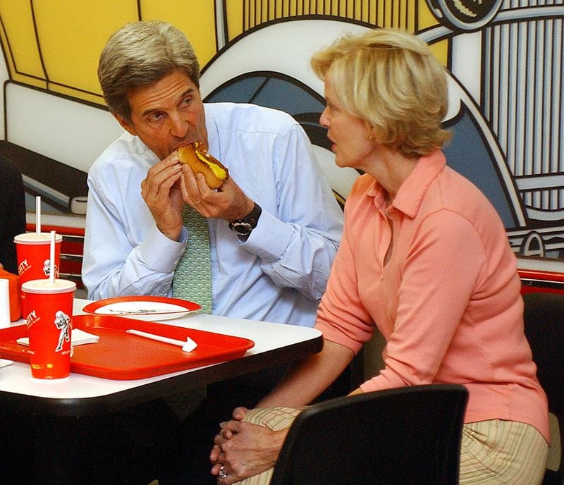 Democratic presidential candidate John Kerry tries a chili dog at the Varsity in Atlanta during the 2004 campaign as he chats with restaurant owner Nancy Gordy Simms (a supporter of President George W. Bush). Curtis Compton/AJC file