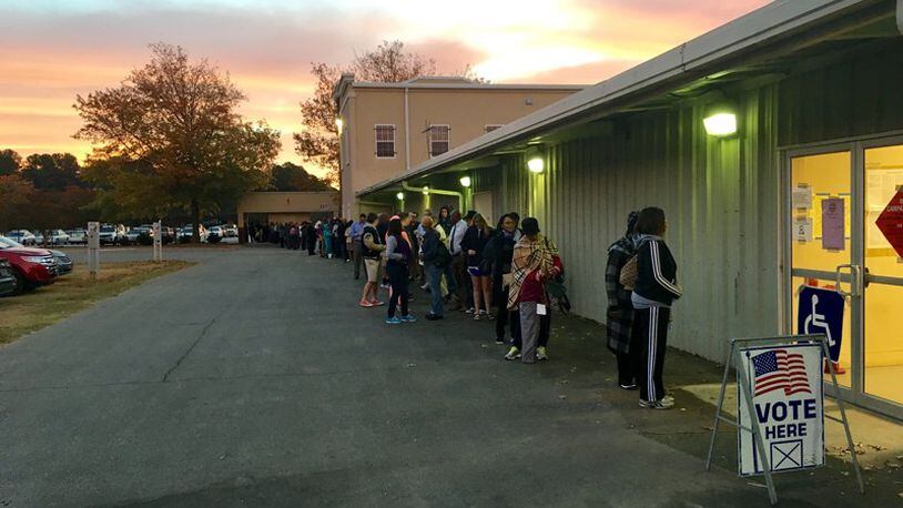 More than 100 people were lined up to vote at the Gwinnett County Fairgrounds in Lawrenceville before polls opened at 7 a.m. Tuesday.