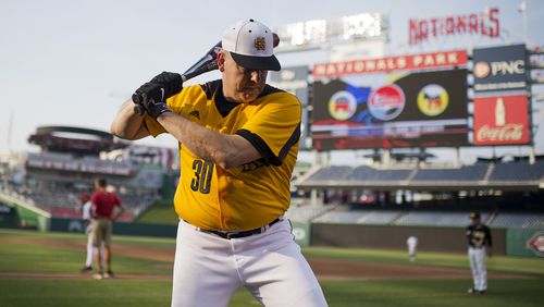 Rep. Barry Loudermilk, R-Ga., warms up before the 54th Congressional Baseball Game in Nationals Park, June 11, 2014.